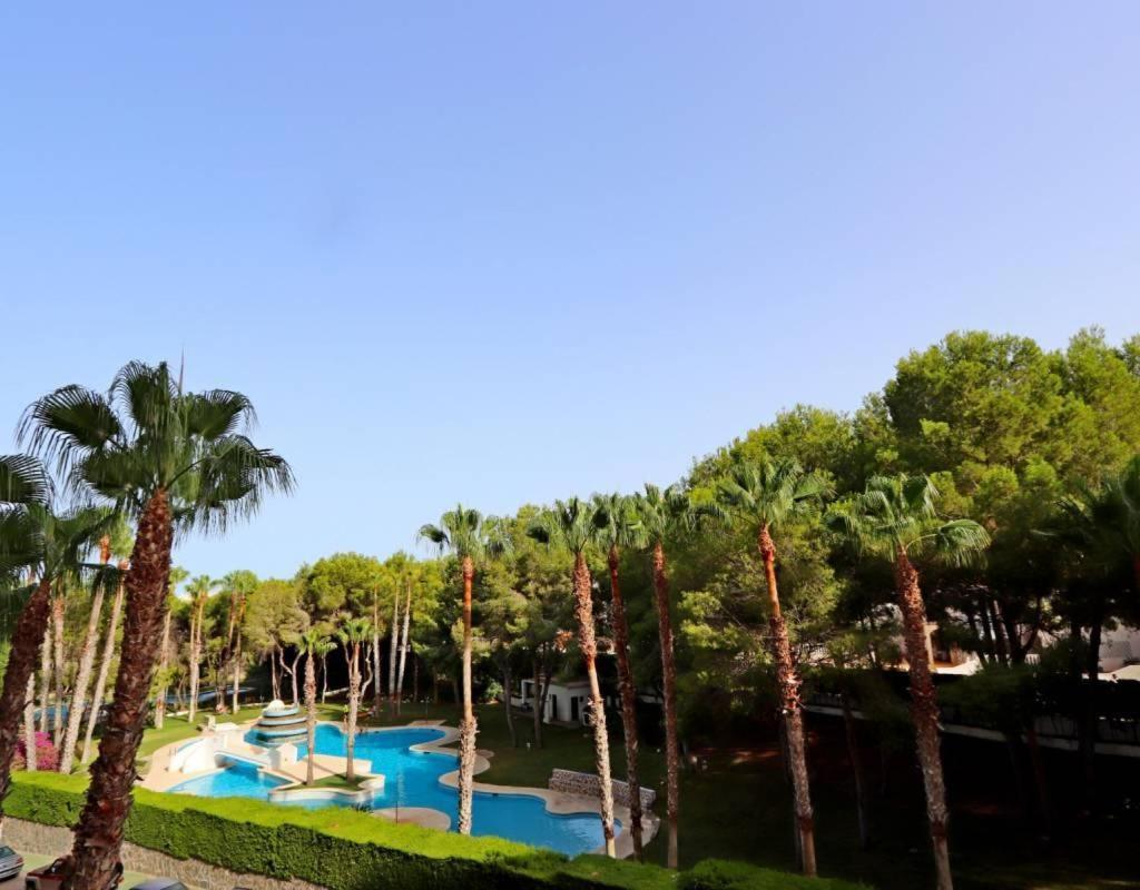 Apartment In Campoamor Overlooking The Swimming Pool Bagian luar foto