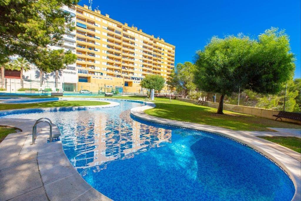 Apartment In Campoamor Overlooking The Swimming Pool Bagian luar foto
