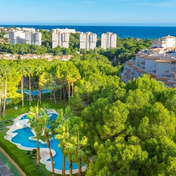 Apartment In Campoamor Overlooking The Swimming Pool Bagian luar foto