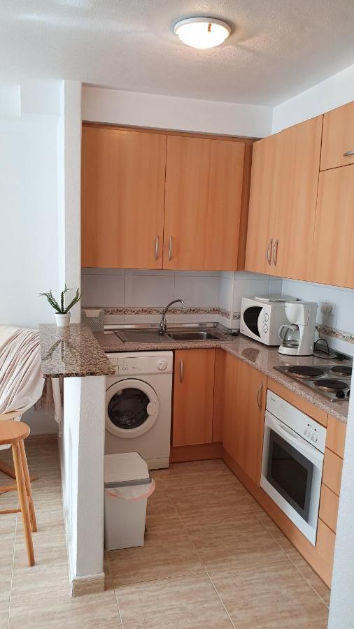 Apartment In Campoamor Overlooking The Swimming Pool Bagian luar foto