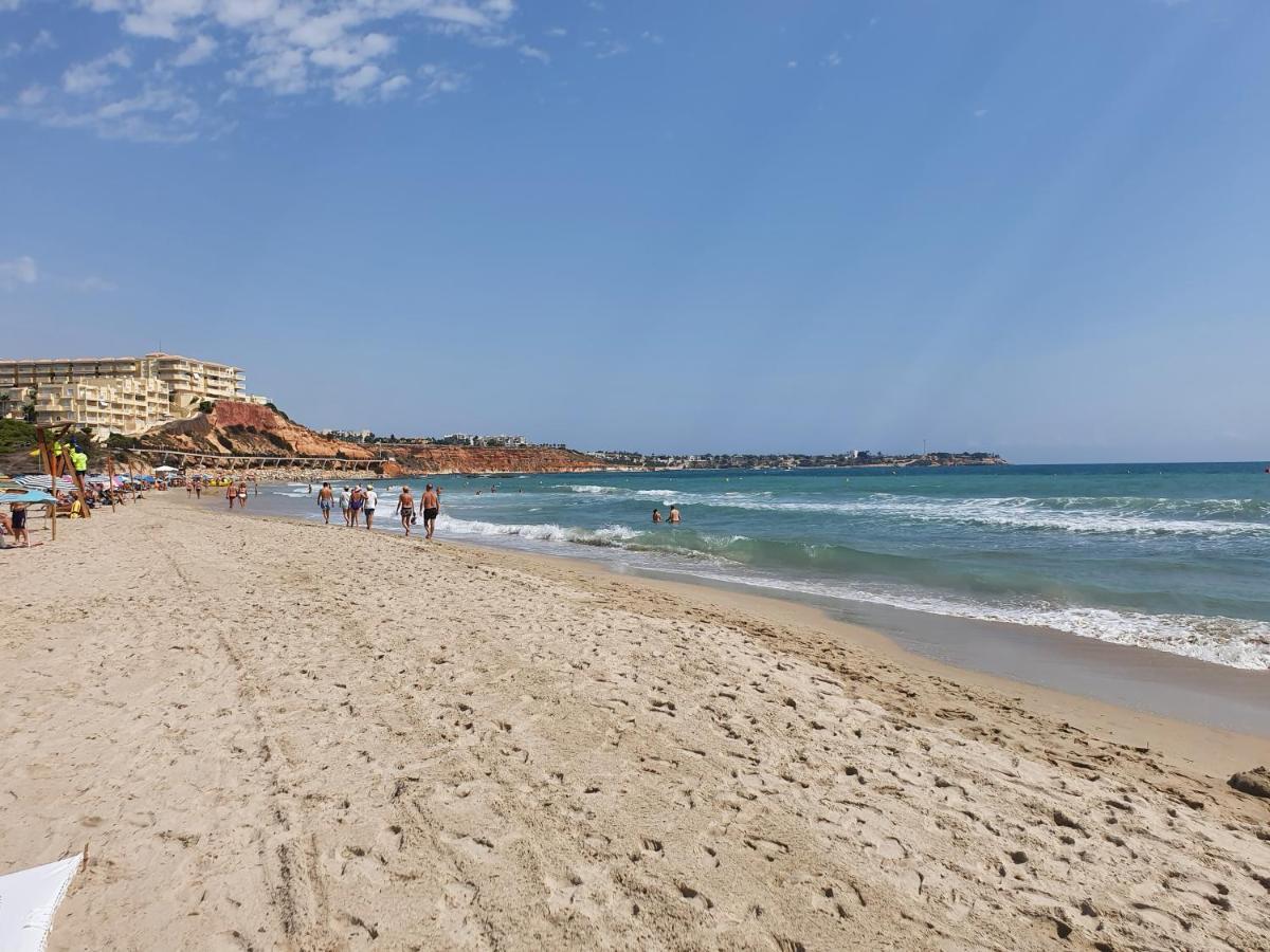 Apartment In Campoamor Overlooking The Swimming Pool Bagian luar foto