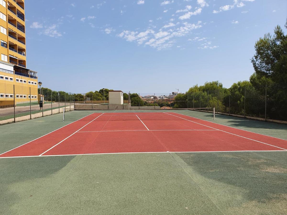 Apartment In Campoamor Overlooking The Swimming Pool Bagian luar foto