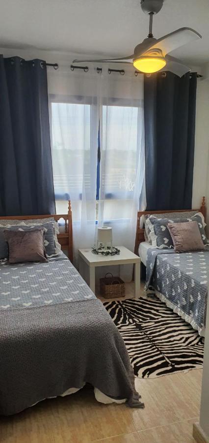 Apartment In Campoamor Overlooking The Swimming Pool Bagian luar foto