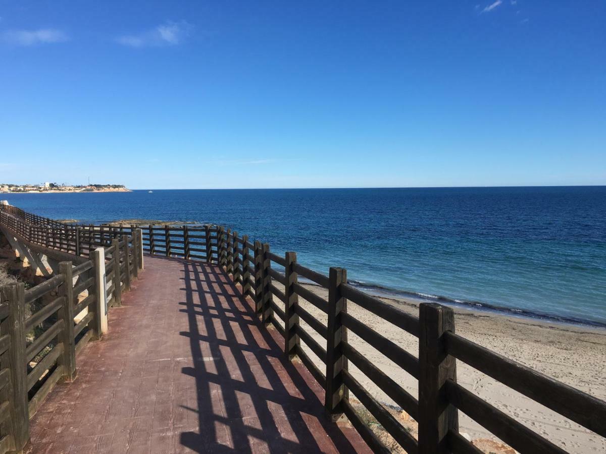 Apartment In Campoamor Overlooking The Swimming Pool Bagian luar foto