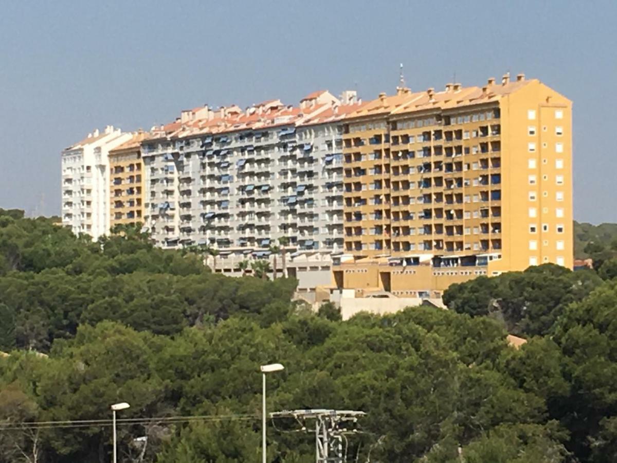 Apartment In Campoamor Overlooking The Swimming Pool Bagian luar foto
