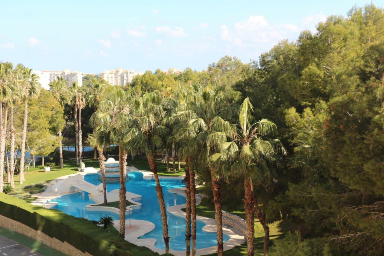 Apartment In Campoamor Overlooking The Swimming Pool Bagian luar foto